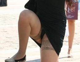 A mature woman in stockings in these upskirt images Image 2