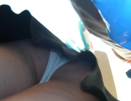 A girl in white dress in this upskirt galery Image 5
