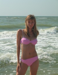 A busty bikini slut undressing on the Bellevue Image 6