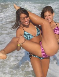 A girl stripping out of her bikini on the Rarawa Nudist Image 4