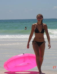 A busty bikini babe undressing on the Peka Peka Image 10