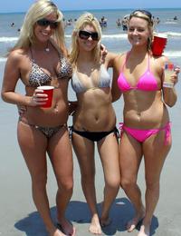 A busty bikini lady undressing on the Natadola Image 3