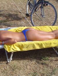 A busty bikini lady undressing on the Natadola Image 4