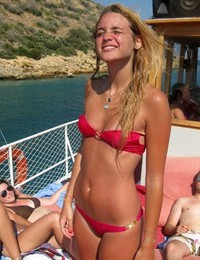 A busty bikini bitch undressing on the Trunk Bay Image 3
