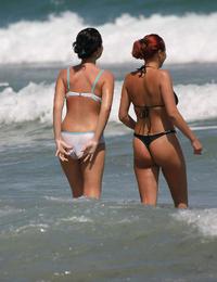 A busty bikini bitch undressing on the Bellevue Image 8