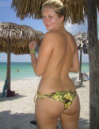 A busty bikini bitch undressing on the Bellevue Image 11