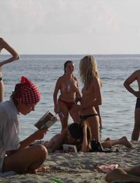 A busty bikini girl undressing on the Coralita Image 9