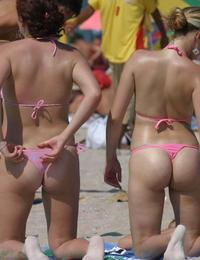 A busty bikini lady undressing on the Cap d'Agde Image 12