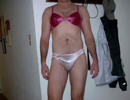 A crossdresser posing in heels and stockings gelery Image 7